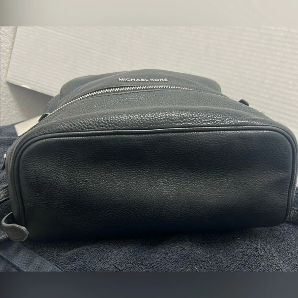 Michael Kors Rhea Medium Backpack in black pebbled leather  silver-tone dust bag